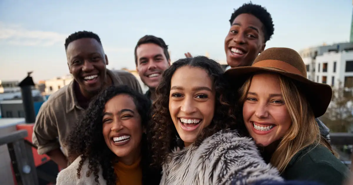 Photo of young adults smiling