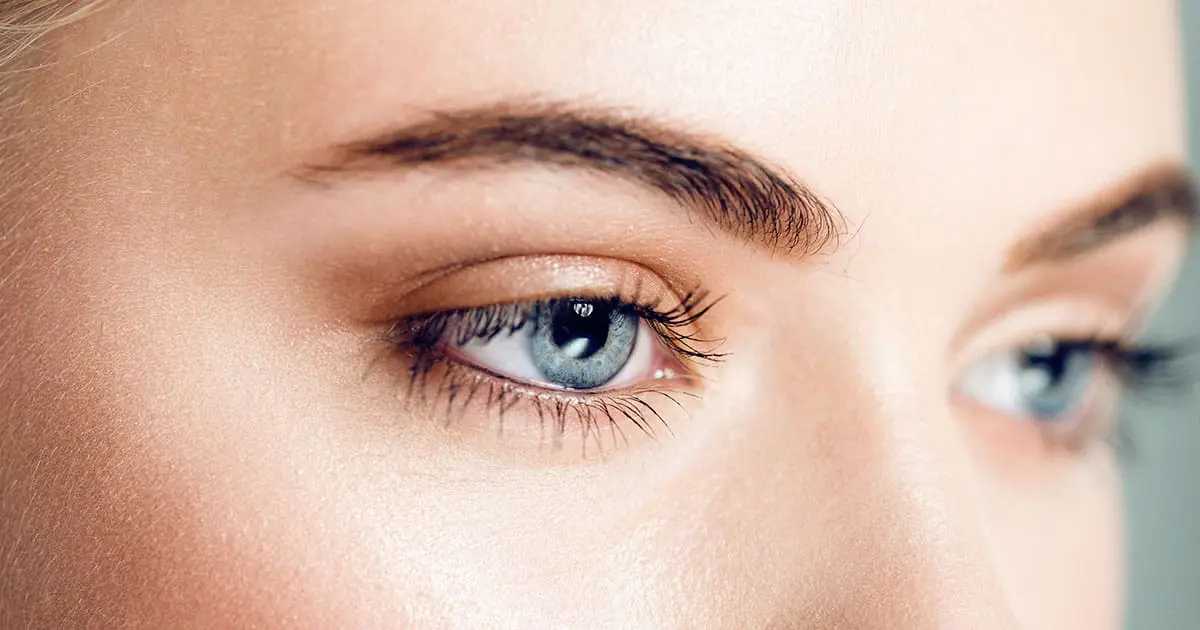 Close-up of a person's blue eyes and eyebrows, showing clear skin and natural makeup. The image reflects the calm confidence often nurtured through mental health services like Choices Psychotherapy.